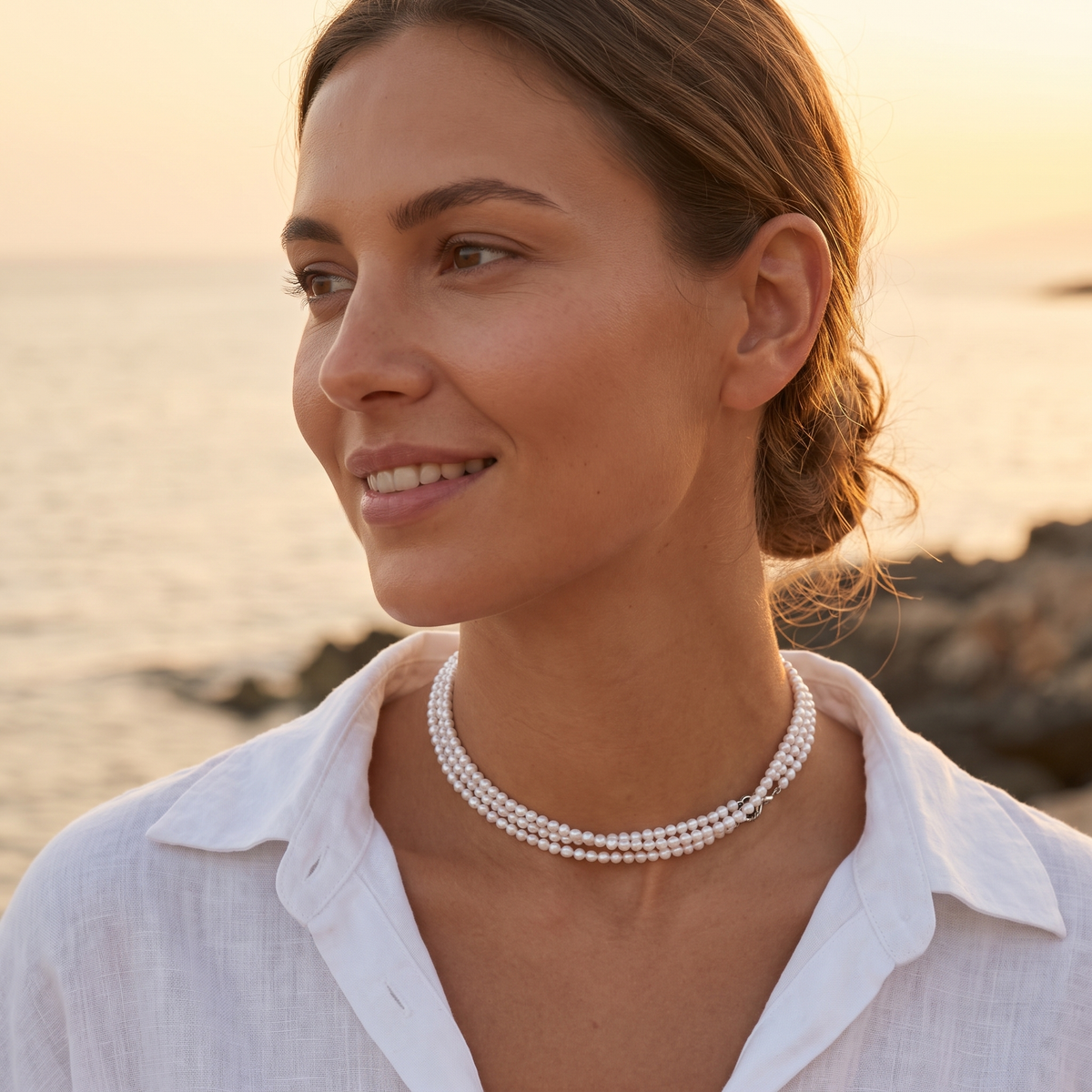 Layered pearl necklace at the beach