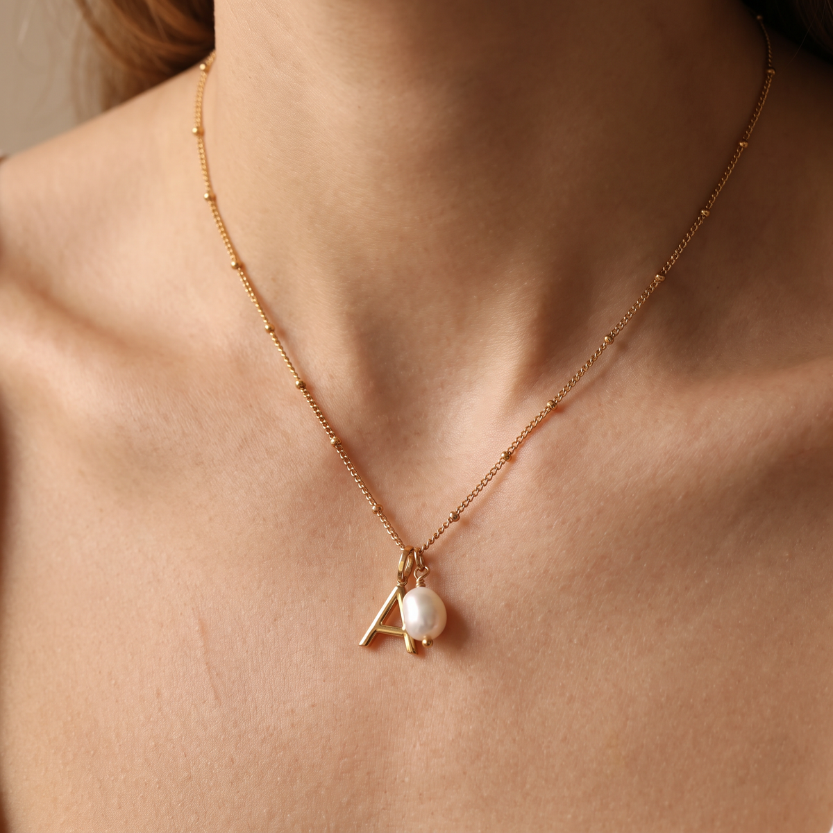 Initial necklace worn