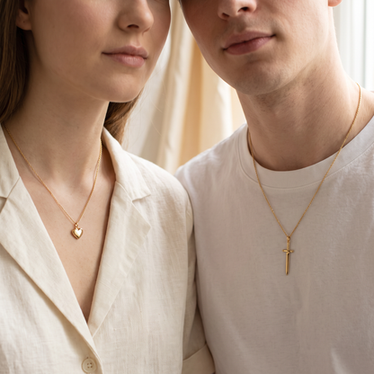 Couple wearing the heart and sword necklaces